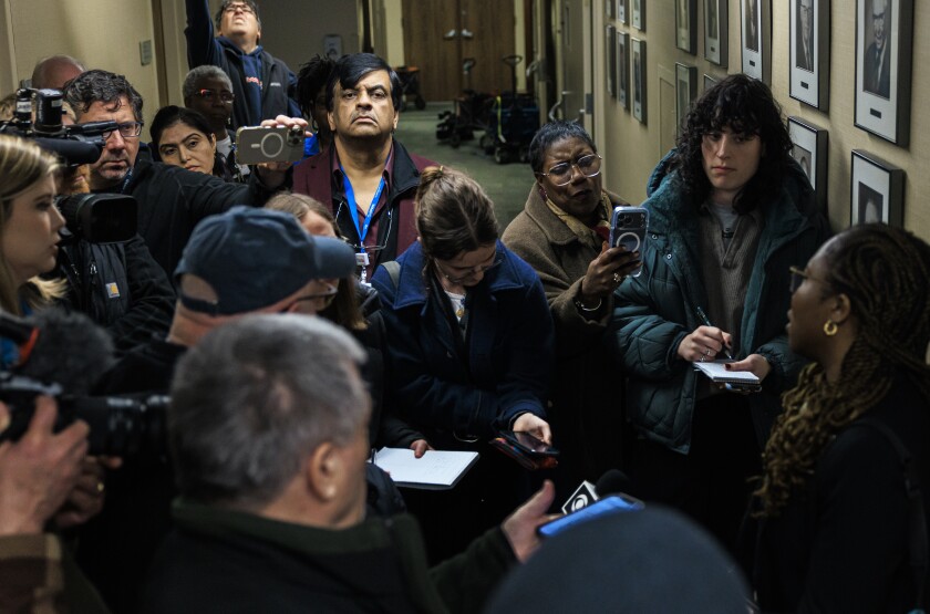 Resilience Healthcare CEO Manoj Prasad listens as Dr. Chidinma Osineme speaks to reporters Wednesday about conditions at West Suburban Medical Center in Oak Park.