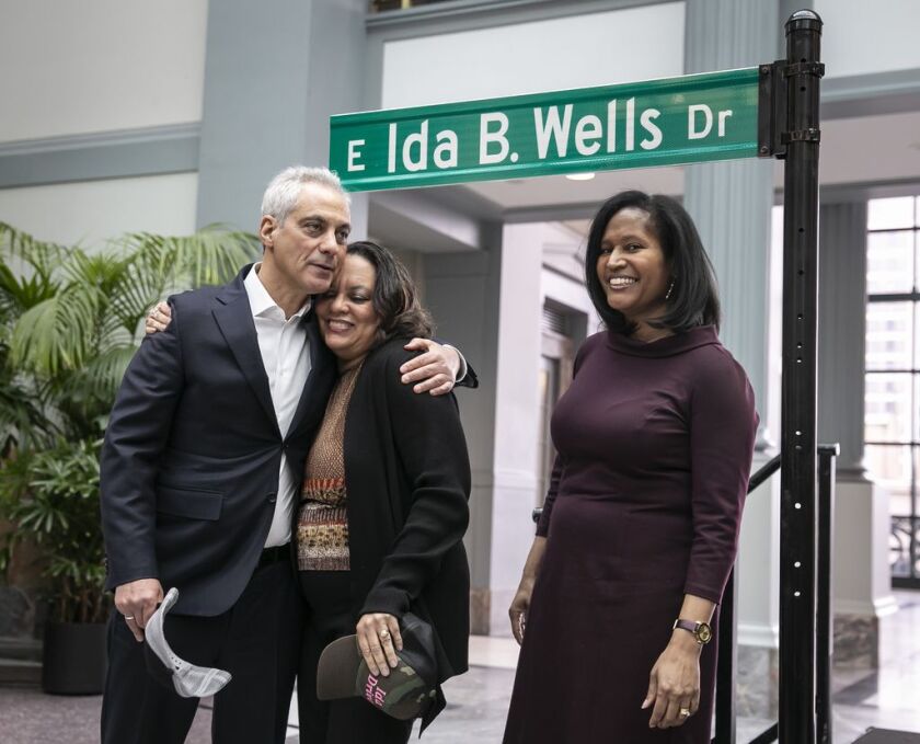 From left, Mayor Rahm Emanuel, Michelle Duster, great-granddaughter of Ida B. Wells and Ald. Sophia King after unveiling the Ida B. Wells Drive street sign at a ceremony at Harold Washington Library Monday. | Rich Hein/Sun-Times