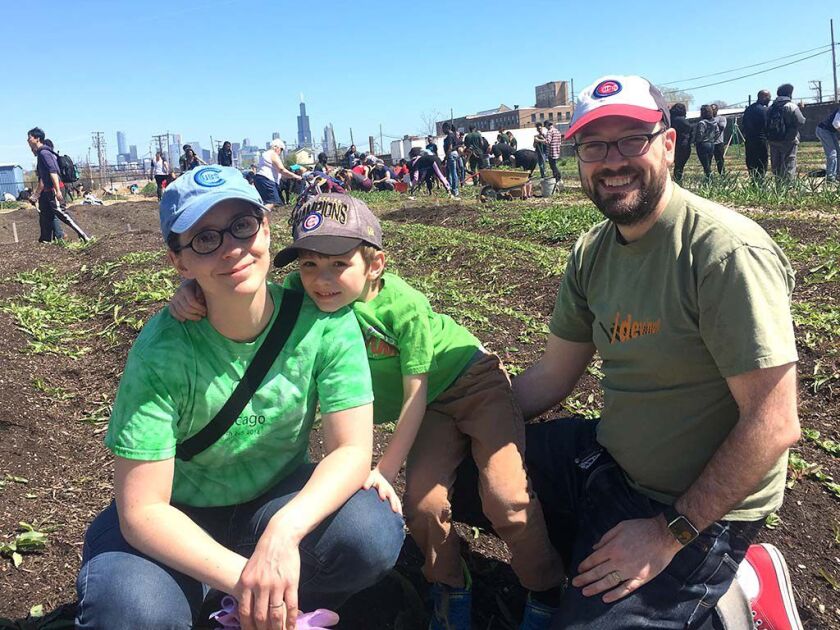 Pamela Bergson with son, Walker, and husband, Josh Emmons, volunteered Sunday at Chicago FarmWorks. | Mitch Dudek/Sun-Times