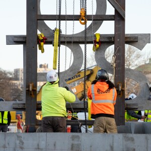 The first panel of the screen text is installed at the Obama Presidential Center.