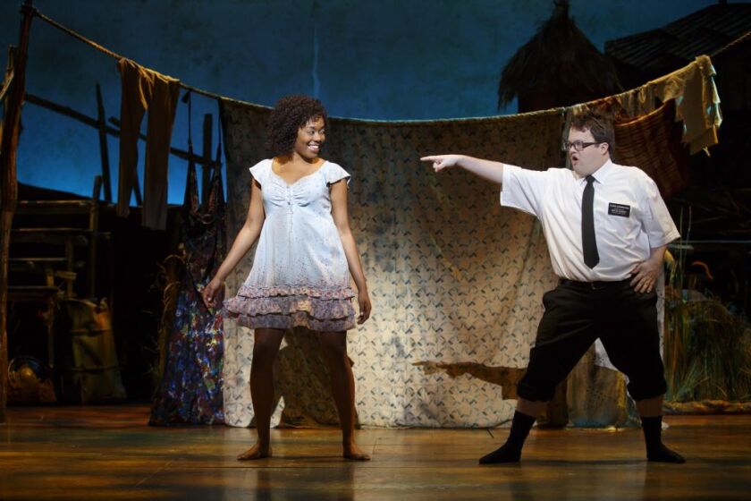 “The Book of Mormon” national touring production stars Cody Jamison Strand as Elder Cunningham and Candace Quarrels as Nabulungi. | Joan Marcus