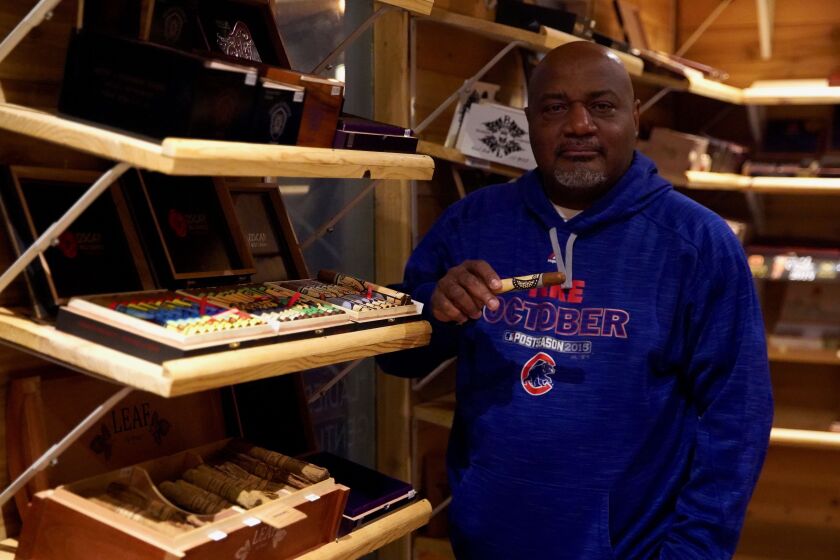 Windy City Cigar Lounge owner Anthony Powell stands in his store’s humidor Wednesday, Jan. 15, 2020 in Bronzeville.