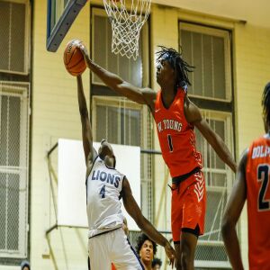 Young’s Sangolay Njie (1) blocks a shot from Lincoln Park’s Ismail Habib (4).
