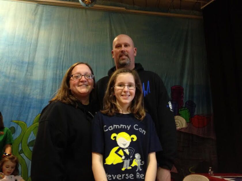 Oriole Park School 5th-grader Emma Dennewitz, with her parents | (Maudlyne Ihejirika)