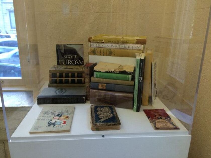 Some of Charlie Trotter’s favorite books, including “As I Lay Dying” and “Ma Gastronomie.” From the exhibit “Charlie Trotter: Chef, Artist, Thinker” at the City Gallery in the Historic Water Tower. | PHOTO BY MIRIAM DI NUNZIO /FOR THE SUN-TIMES