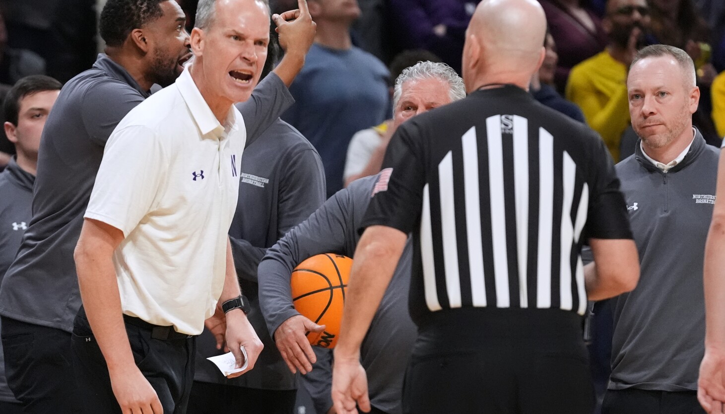 Nick Martinelli had it rolling, as usual, and one of Chris Collins' worst seasons isn't over yet. The 15th-seeded Wildcats beat Penn State 76-66 at the United Center to set up a game against No. 10 seed Indiana on Wednesday.