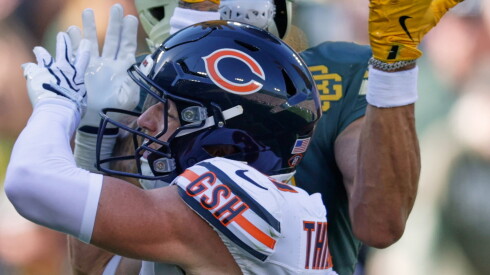 The Packers' Christian Watson catches a touchdown pass over the Bears' Dillon Thieneman during the second half in Green Bay, Wis., Sunday, Oct. 11, 2026.