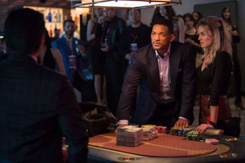 <strong><em>Will Smith and Margot Robbie star as super-slick con artists in “Focus.” | Warner Bros.</em></strong>