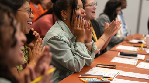 Attendees clap during Edgardo Miranda-Rodriguez's superhero workshop at the Obama Presidential Center.