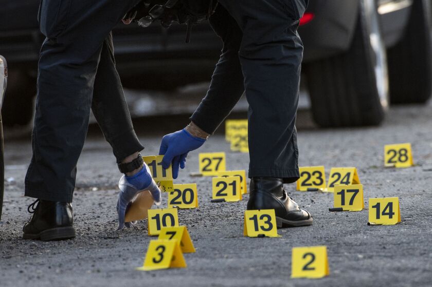 Chicago police work the scene where an 8-year-old boy was shot in the knee while playing outside near 18th and Kildare, in the Lawndale neighborhood, Thursday, May 13, 2021.