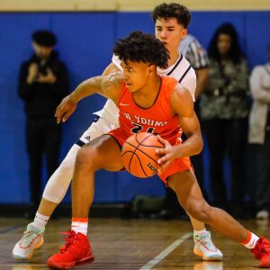 Young’s Jaehshon Thomas (24) moves the ball past Lincoln Park.