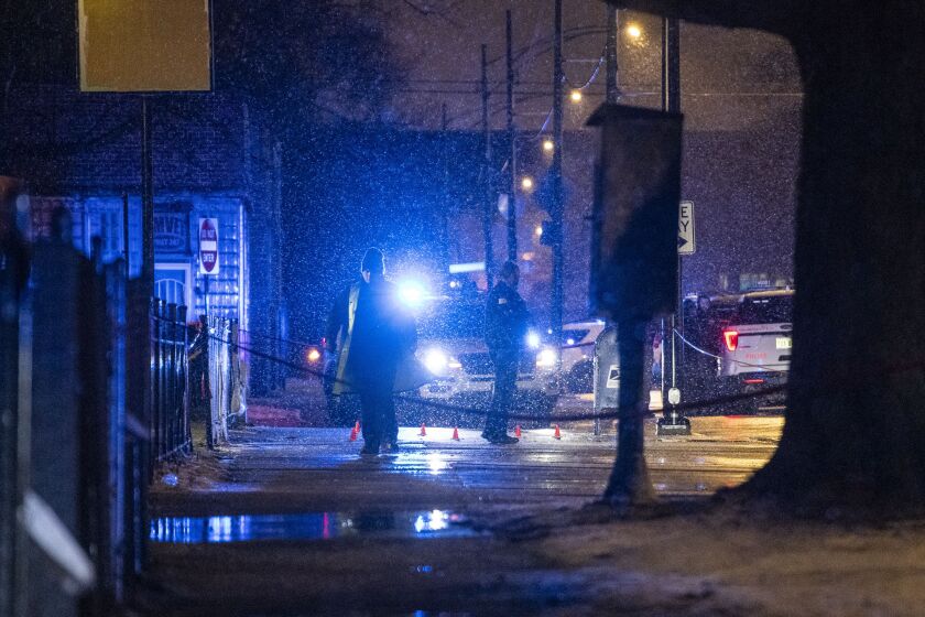 Chicago police investigate the scene where multiple people were shot and one was killed in the 7900 block of South Avalon, Tuesday, Feb. 25, 2020.