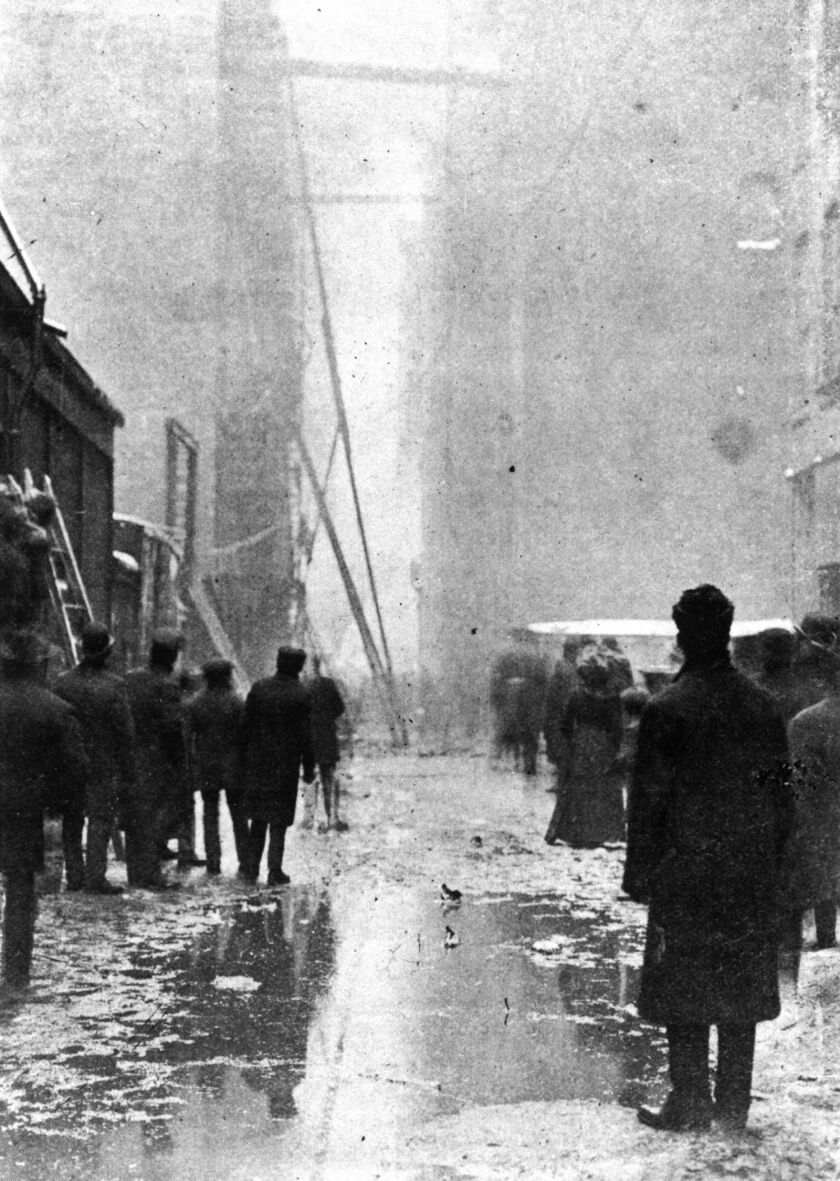 Chicagoans look down “death alley” toward the Iroquois Theatre, after the Dec. 30, 1903 fire that killed more than 600 people, in this undated handout photo. | Photo courtesy of the Chicago Historical Society, distributed by the Associated Press