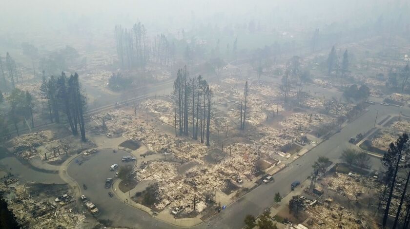 This aerial image shows a neighborhood destroyed by a wildfire in Santa Rosa, Calif., Tuesday. Newly homeless residents of California wine country took stock of their shattered lives Tuesday, a day after deadly wildfires destroyed homes and businesses. |