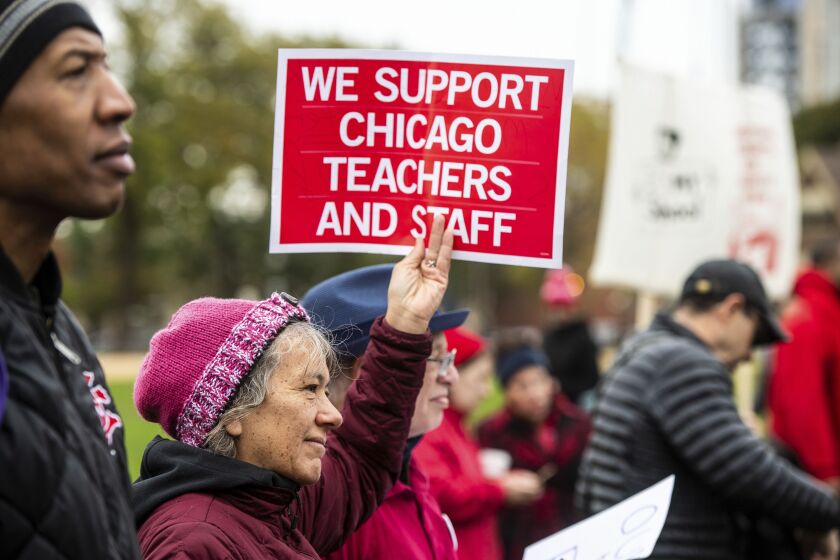 Educators, students and union laborers rally at Union Park during the Chicago Teachers Union strike in 2019. The union is on track to finalize a safety agreement with Chicago Public Schools this week.