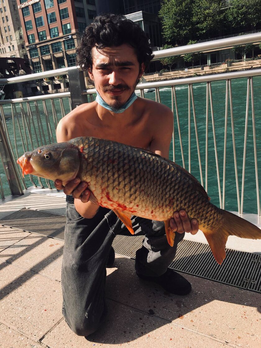 Jesse Gonzalez with a big Chicago River carp. Provided photo