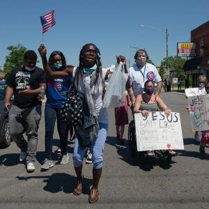 Adrienne Johnson dances during the West Side interfaith peace march on June 12, 2020.