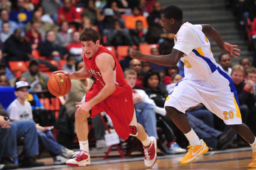 David Sobolewski brings the ball down for Benet past Simeon’s Kendrick Nunn.