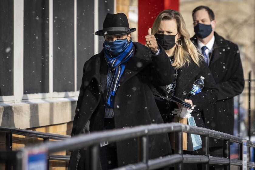 Mayor Lori Lightfoot and staff members walks into William H. Brown School of Technology at 54 N. Hermitage Ave. on the Near West Side, Thursday morning, Feb. 11, 2021