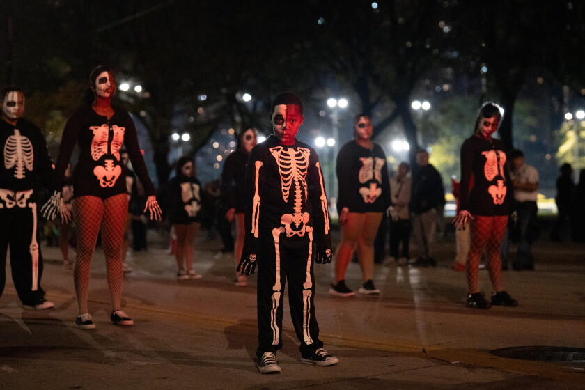 Kids with Second II None Performance Academy perform during the Arts in the Dark Halloween Parade on Columbus Drive.