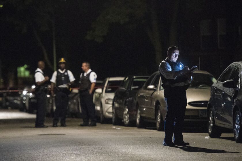 Police investigate a shooting about 11 p.m. Monday in the 7200 block of South Bennett | Tyler LaRiviere/Sun-Times
