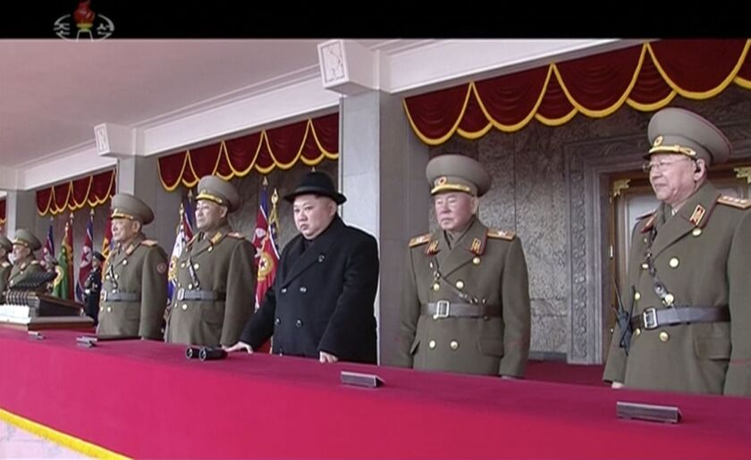 In this image made from video released by KRT on Feb. 8, 2018, North Korean leader Kim Jong Un, center, watches the military parade in Pyongyang on Thursday. | via AP