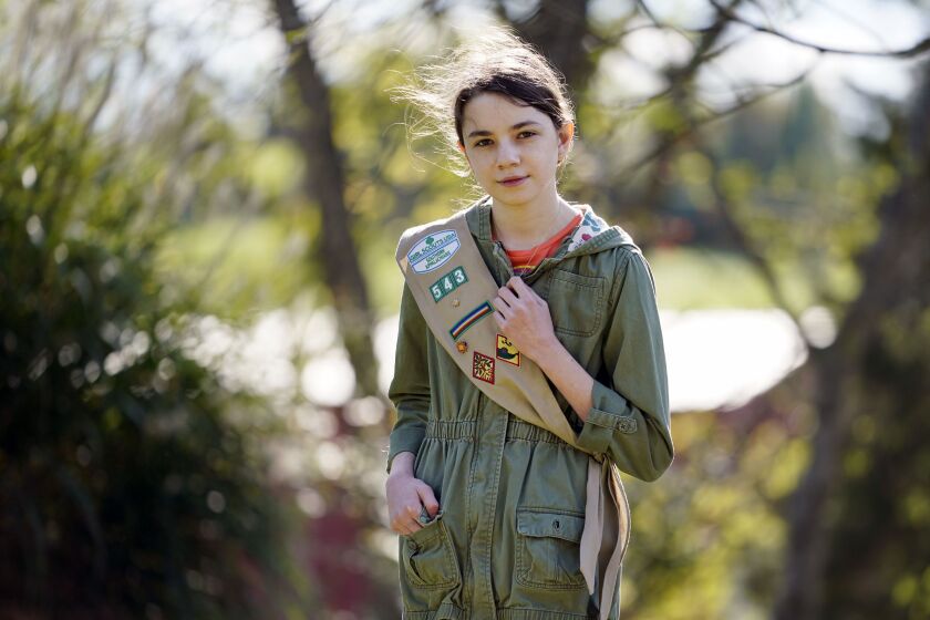 Olivia Chaffin, 14, stands for a portrait with her Girl Scout sash in Jonesborough, Tenn., on Sunday, Nov. 1, 2020.