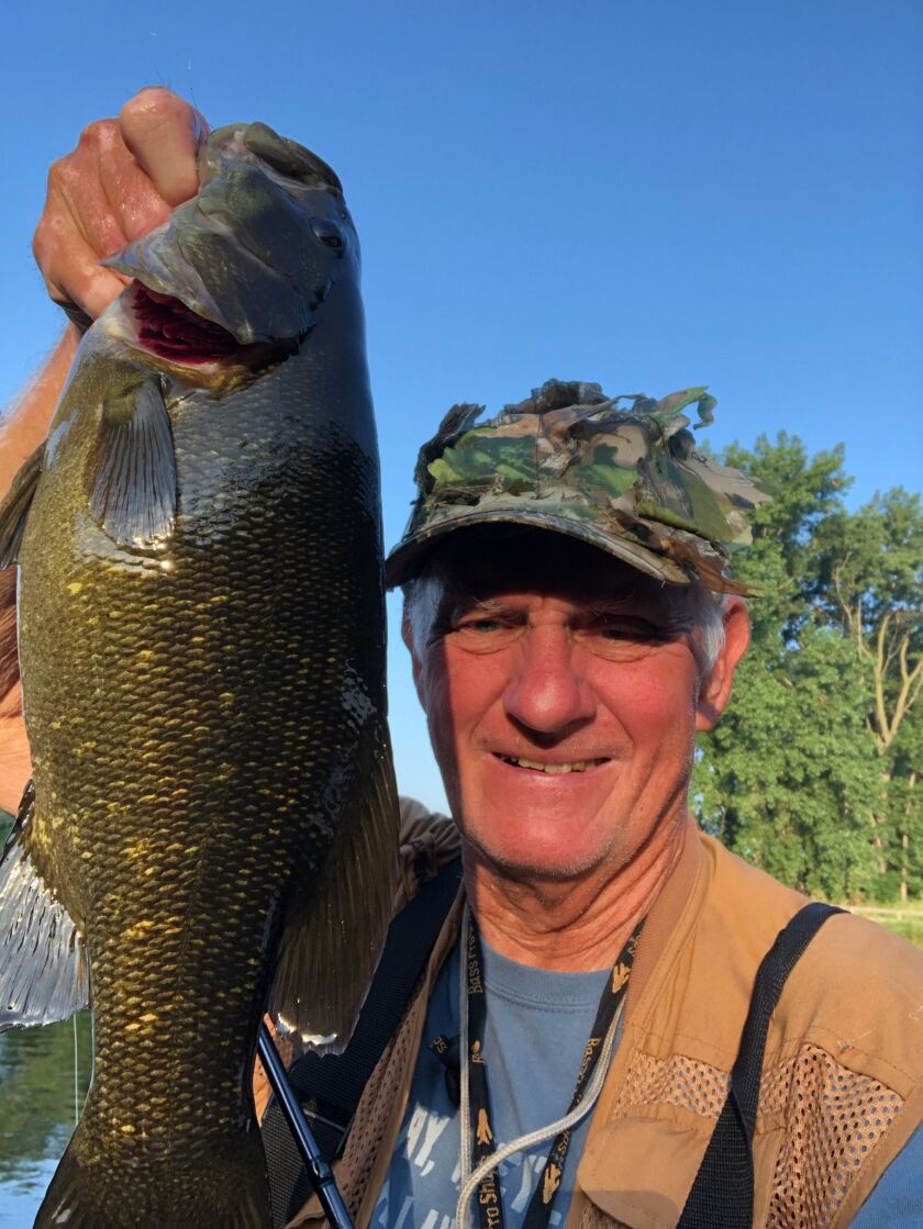 George Peters with a 19-inch smallmouth bass from the Kankakee River. Provided photo