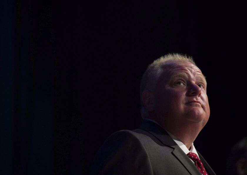 In this July 15, 2014, file photo, Mayor Rob Ford pauses while participating in a mayoral debate in Toronto. Darren Calabrese / The Canadian Press via AP