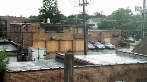 The boarded-up South Chicago Chapel funeral home is seen from the bedroom window of James Kinney, a decades-long resident of South Deering who lives near the South Chicago Chapel funeral home, Wednesday, Aug. 12, 2026.