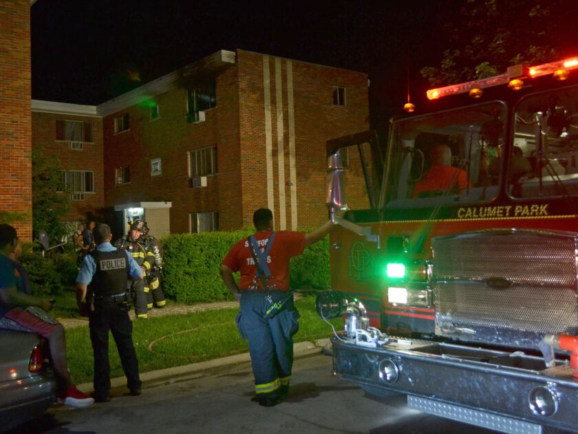 Fire officials investigate an apartment fire about 3:30 a.m. Saturday, June 30, 2018 in the 12400 block of South Winchester Ave in Calumet Park. | Justin Jackson/ Sun-Times