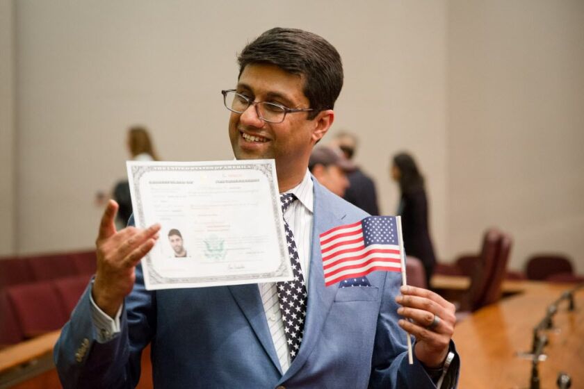 Farac Baluch, born in Pakistan, became a U.S. citizen at a naturalization ceremony Monday at Chicago City Hall. | Santiago Covarrubias/For the Sun-Times