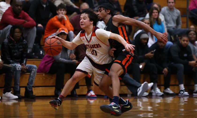 Brother Rice’s Cale Cosme (10) works to get the ball into the front court against Romeoville.