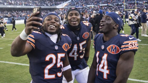Chicago Bears running back Kyle Monangai #25, linebacker Amen Ogbongbemiga #45 and wide receiver Olamide Zaccheaus #14 take a selfie as they walk off the field after the Bears beat the Pittsburgh Steelers 31 - 28 at Soldier Field, Sunday, Nov. 23, 2025.