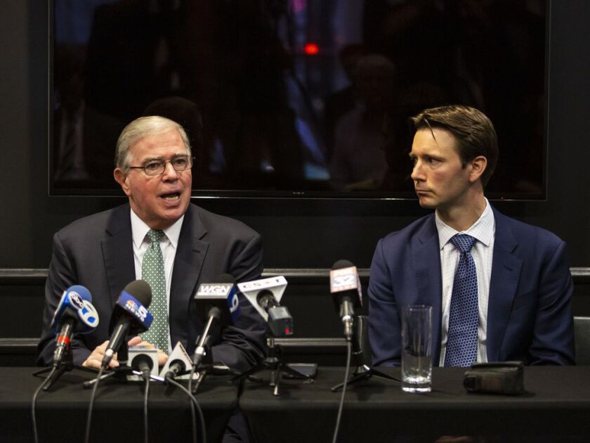 Attorney Patrick Salvi (right) looks on as attorney Todd Smith speaks about lawsuits against Sterigenics, alleging the medical equipment sterilization company has been emitting cancer-causing chemical ethylene oxide into the atmosphere, during a press con