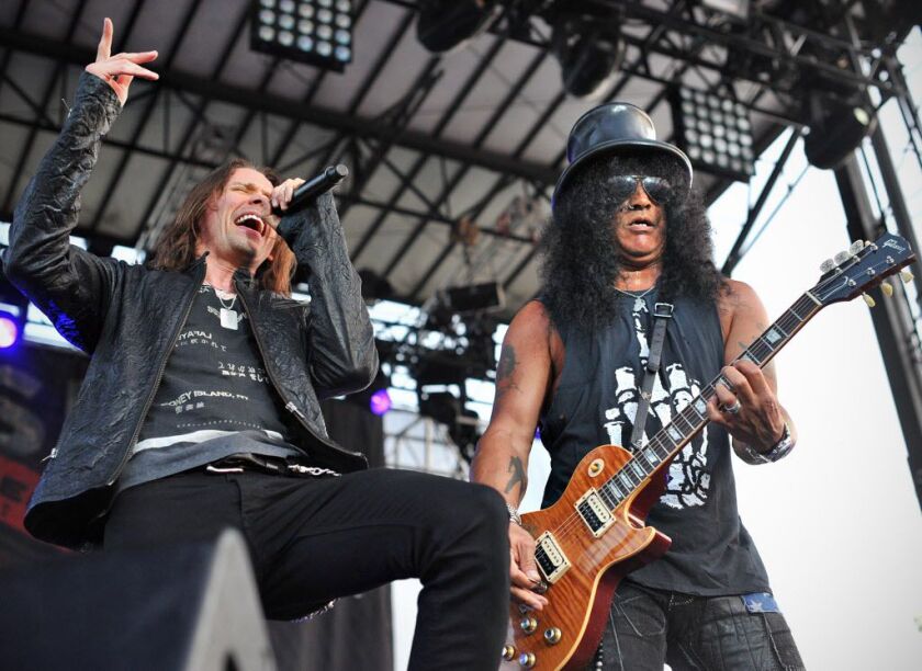 Myles Kennedy sings as Slash plays guitar at Ribfest in Naperville on Friday night, July 5, 2013.
