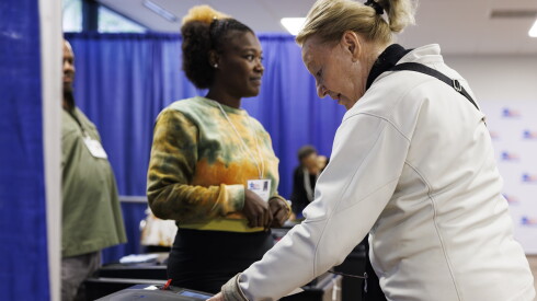 Patricia Tennison turns in her ballot during early voting at the Chicago voter supersite at 137 S. State St. in the Loop, Thursday, Oct. 1, 2026.