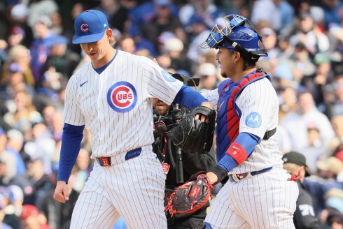 Ben Brown, right, and Miguel Amaya celebrate the Cubs' 2-0 win Saturday.
