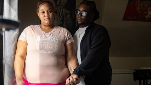 Alexis Williams and Juanyea Vinson Sr. stand in their Portage Park home on the Northwest Side.