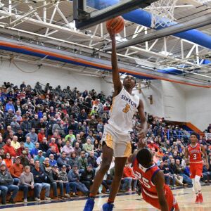 Simeon’s Antonio Reeves (3) gets around Curie’s Armond Williams (25), Saturday 12-29-18. Worsom Robinson/For Sun-Times