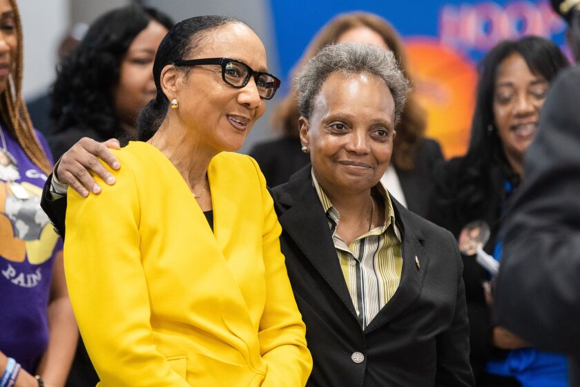 Chicago Mayor Lori Lightfoot stands with state Sen. Jackie Collins.