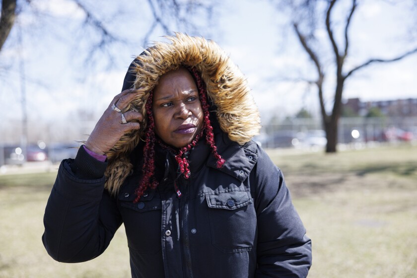 Rennea Finley stands outside of the George N. Leighton Criminal Courthouse at 2600 S. California Ave, Monday, March 24, 2025. Her nephew Derrick Taylor, 32, was charged with child endangerment after 8-year-old boy Josiah Hooker, was shot and killed, and another child, a 5-year-old boy was injured.