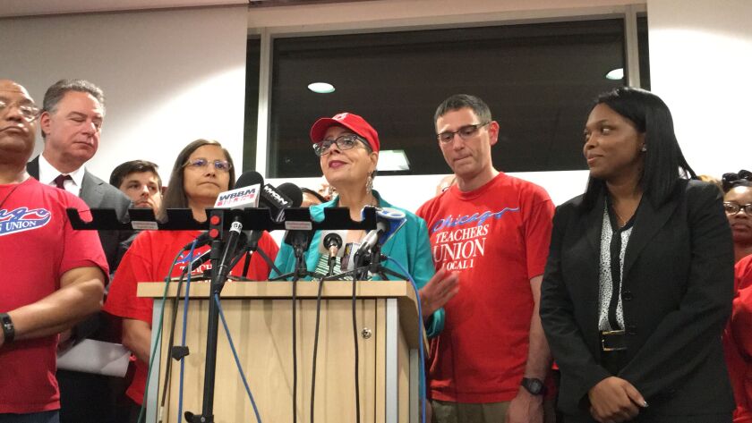 Janice Jackson (right) stands with Karen Lewis (at podium) and other Chicago Teachers Unions leaders at October 2016 news conference announcing teachers’ contract. | Andy Grimm / Sun-Times files