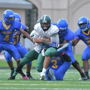 Prosser’s James Duke (3) wraps up Kelly quarterback Khali Hill. Worsom Robinson/For the Sun-Times.