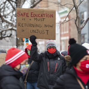 Chicago Teachers Union members and their supporters march and protest in Pilsen after a press conference outside Joseph Jungman Elementary School to call for “safety, equity and trust in any school reopening plan” on Martin Luther King Jr. Day, Monday morning, Jan. 18, 2021.