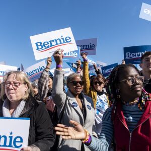 Sanders supporters cheer and waiver their signs around while a Bernie Sanders song plays, ahead of the Bernie Sanders rally, Saturday, March 7, 2020.