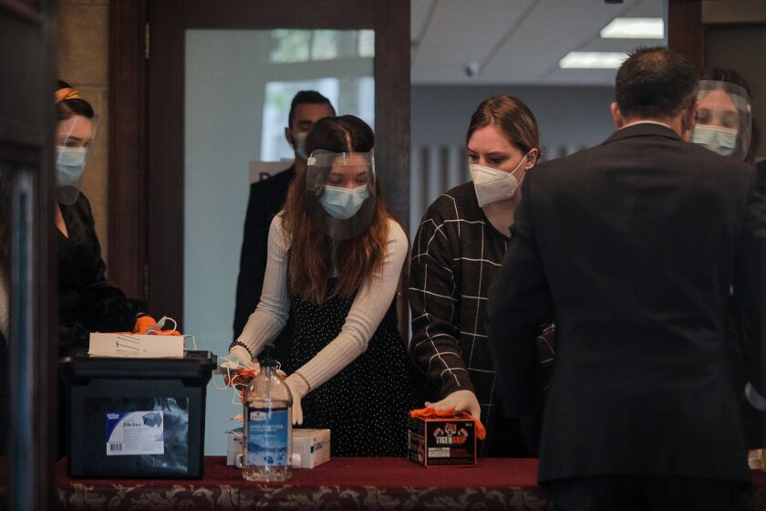 Members of Elim Romanian Pentecostal Church prepare for a service on May 10, 2020.
