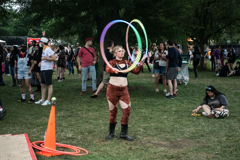 A festival goer performs with hula hoops on the second day of Pitchfork Music Festival.