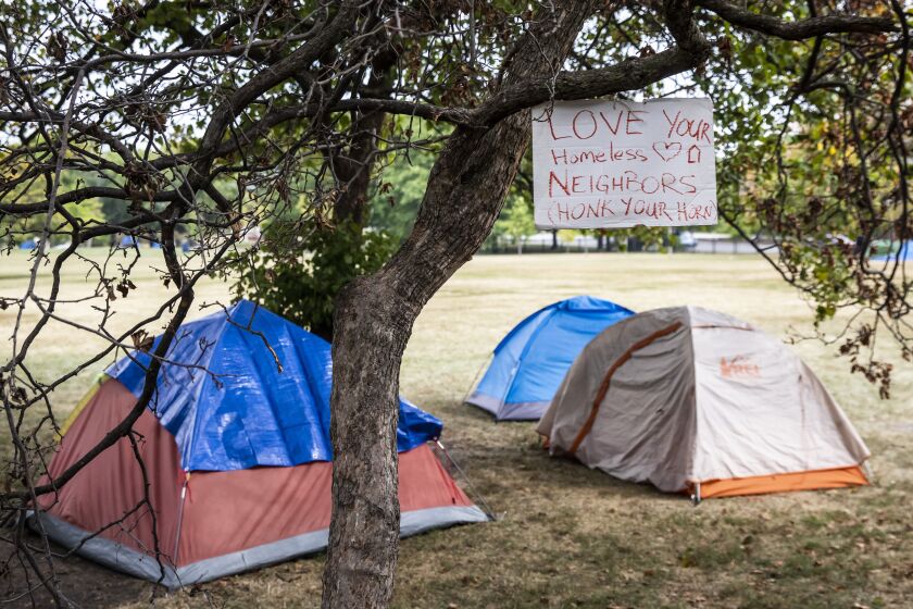 Protesters with #RiseUptown gather in the park east of Weiss Memorial Hospital to discuss homelessness in the area and call for more affordable housing in Uptown, Tuesday morning, Sept. 6, 2022.