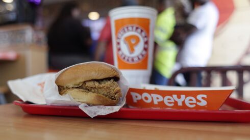 A chicken sandwich is displayed at a Popeyes fast food restaurant in Kyle, Texas, on Aug. 22, 2019. A new book, “Secrets of a Tastemaker: Al Copeland, The Cookbook,” released last month, helped mark the 50th anniversary of Popeyes Famous Fried Chicken.